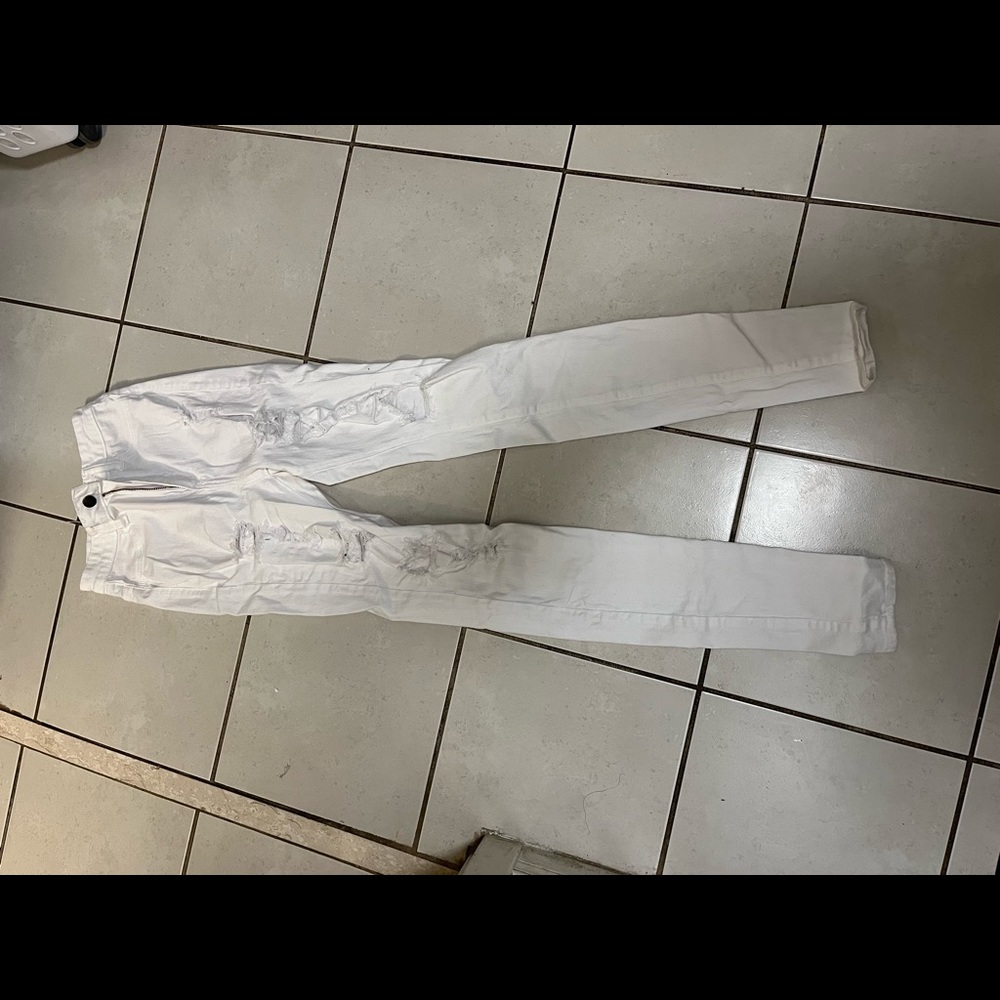 Small sized Fashion Nova white ripped jeans